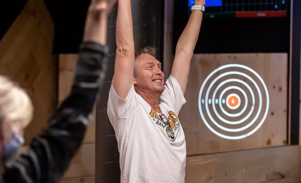 Guest celebrating after axe throwing at AXED @ The Bunker